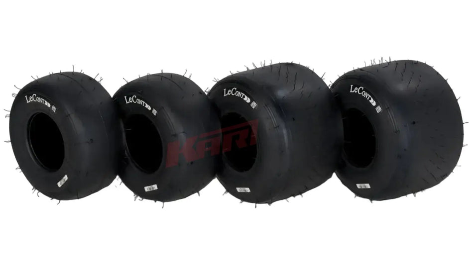 Set of four black reifen lecont lpm prime racing tires with aggressive tread and spiked edges